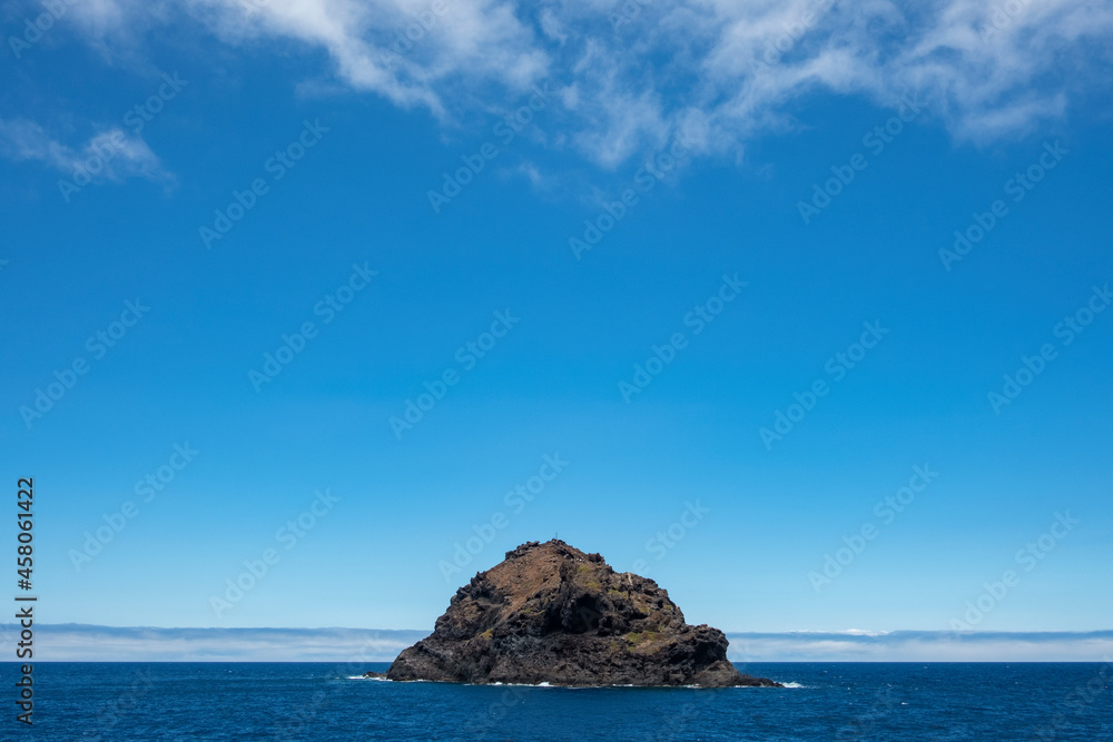 Roque de Garachico emerging from the Atlantic Ocean nearby Garachico town, Tenerife, Canary Islands, Spain, small uninhabited islet also known as roque located 300 m off the north coast of the island
