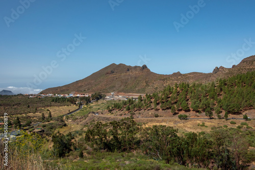 Lush green valley surrounding the quaint town of Santiago del Teide situated on the western part of the island, tranquil and picturesque rural vistas in a sunny day, Tenerife, Canary Islands, Spain 