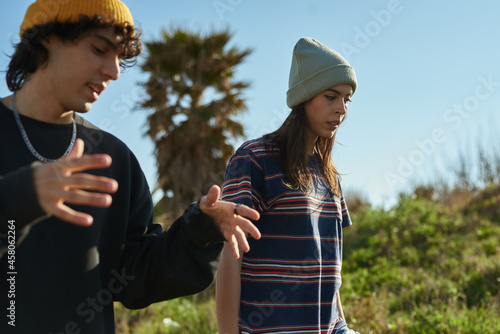 Two captivated young people in deep conversation