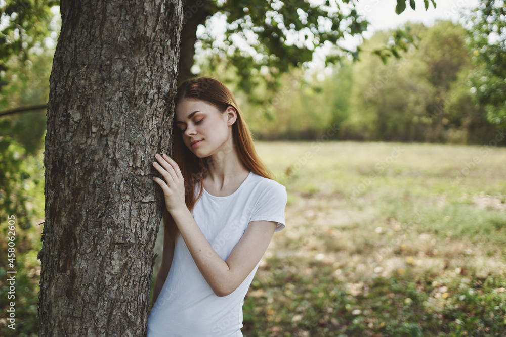 cheerful woman near the tree nature Sun freedom journey cheerful woman near the tree nature Sun freedom journey