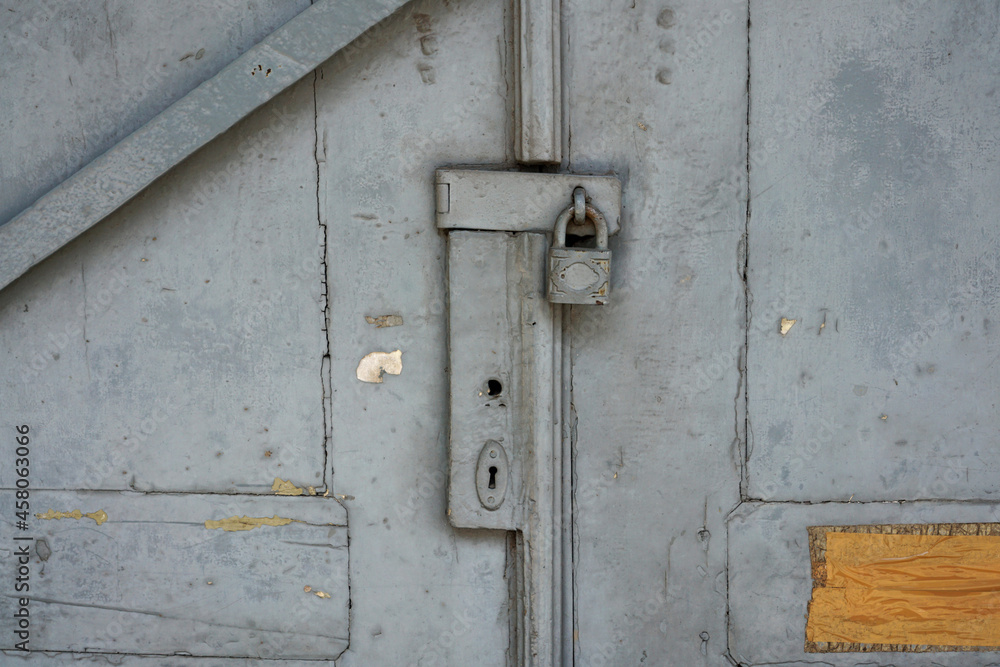 Classic old wooden door and rusty lock        