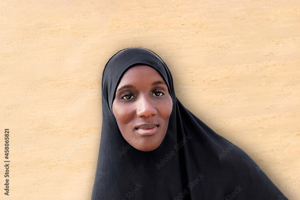 Ταπετσαρία Beautiful African woman wearing a black veil in front of a  beige wall