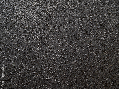 surface of black metal plate with paint drops 