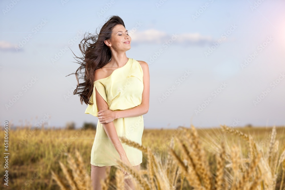 Happy young beautiful woman in a wheat field. Happy young beautiful woman in a wheat field.