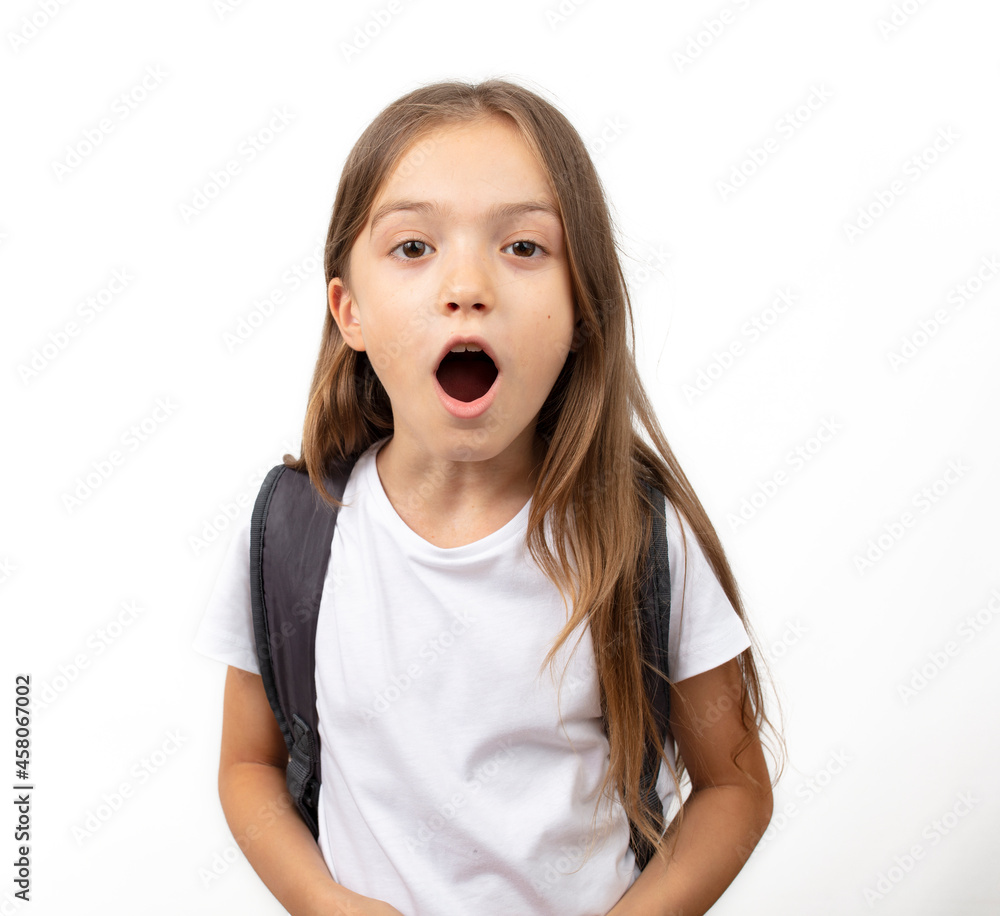 Student girl kid on white background looking at camera with surprised facial expression. Student girl kid on white background looking at camera with surprised facial expression.