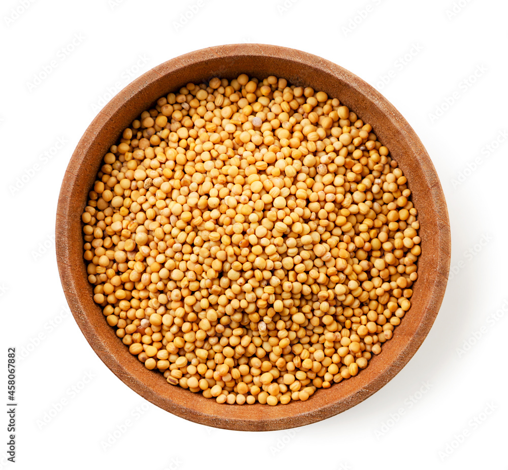Mustard seeds in a plate on a white background, isolated. Top view Mustard seeds in a plate on a white background, isolated. Top view