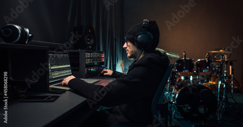 Sound engineer working in recording studio.