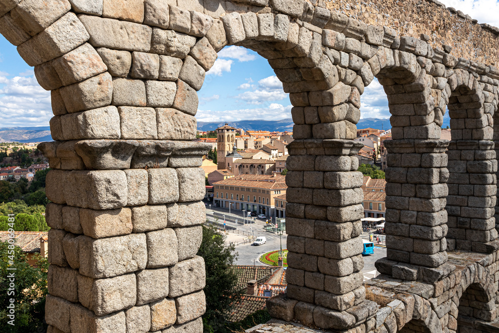 Segovia, Spain. The Church of Santos Justo y Pastor in the arches of the Acueducto de Segovia, a Roman aqueduct or water bridge built in the 1st century AD Segovia, Spain. The Church of Santos Justo y Pastor in the arches of the Acueducto de Segovia, a Roman aqueduct or water bridge built in the 1st century AD
