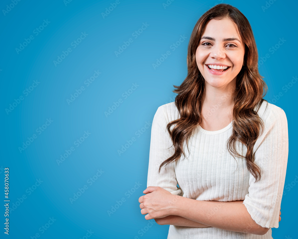 Young Latin woman wearing casual clothes happy face smiling with crossed arms looking at the camera. Young Latin woman wearing casual clothes happy face smiling with crossed arms looking at the camera.