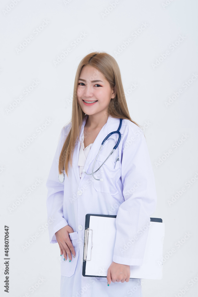 Portrait of young Female doctor with stethoscope on white background,Asian woman,Thailand people,She holding file in hand Portrait of young Female doctor with stethoscope on white background,Asian woman,Thailand people,She holding file in hand