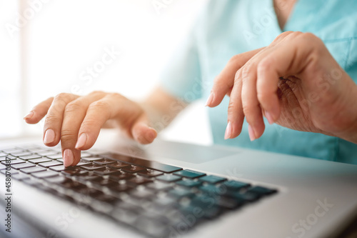 Woman hands with laptop