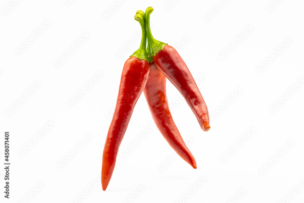 Three hot peppers isolated on a white background.