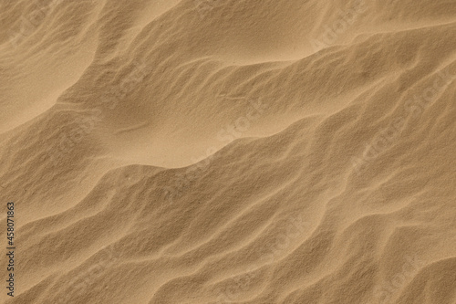 Closeup view of sand dune in desert as background © New Africa