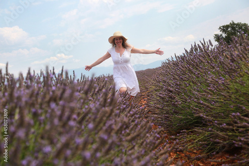 Wallpaper Mural woman portrait with flowers field background Torontodigital.ca