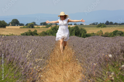 woman portrait with flowers field background
