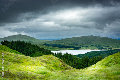 Landscape along the West highland Way in Scotland. The green hills surround Loch Tulla.