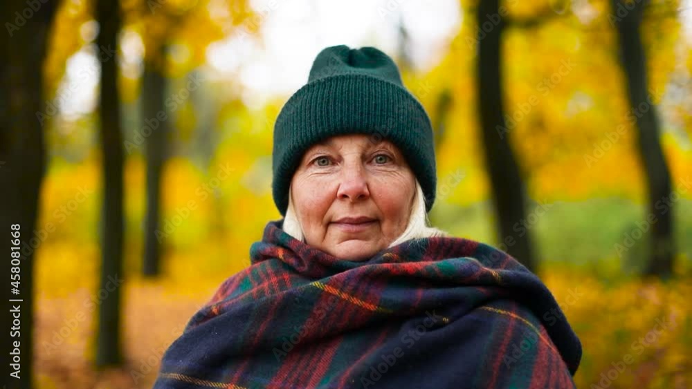Woman walking feeling free and happy in autumn foliage forest woods in city park, yellow leaves landscape in October. Woman walking feeling free and happy in autumn foliage forest woods in city park, yellow leaves landscape in October.