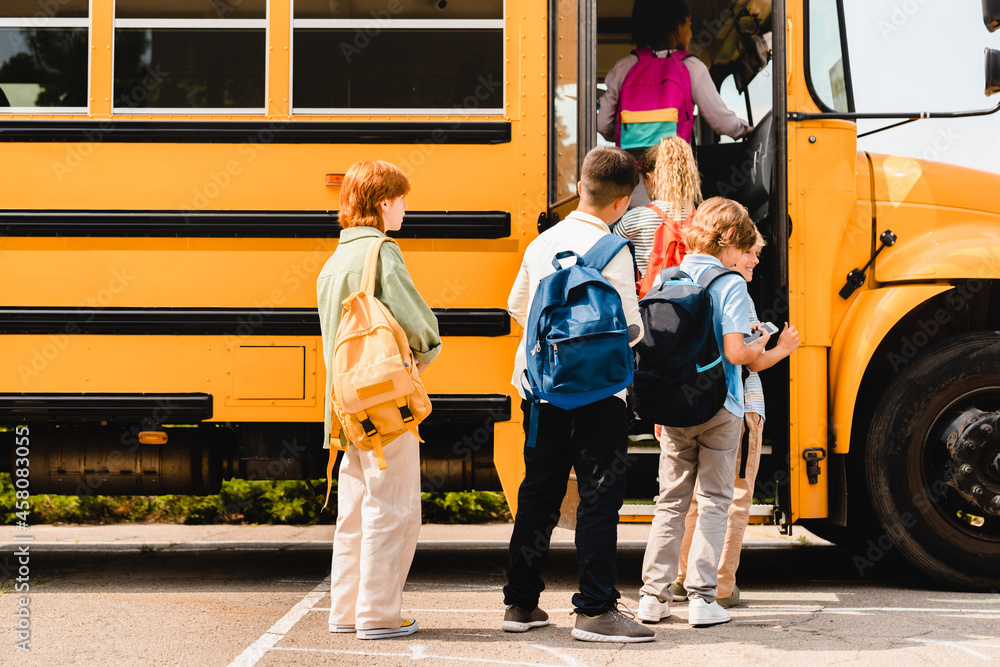 Children Standing In Line For Bus