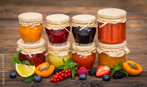 Fotografie Various homemade fruit jam in the jars