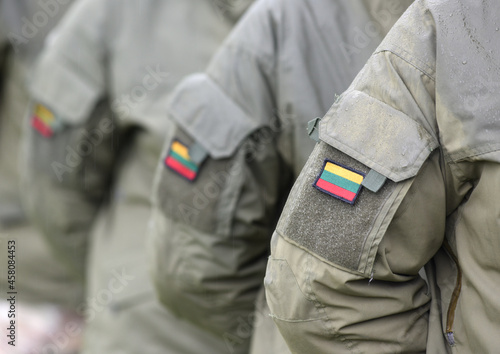 Lithuanian Armed Forces. Lithuania flag on soldiers arm. Lithuanian military uniform. Lithuania troops