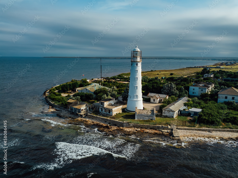 Lighthouse on the sea coast, aerial drone view