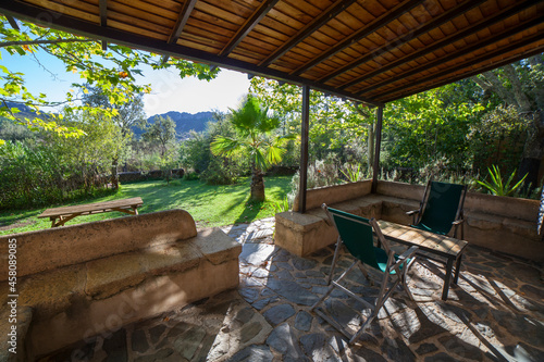 Porch country house with folding canvas deckchairs © WH_Pics