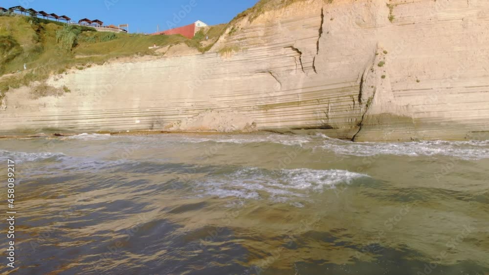 Logas beach on Corfu island. Drone hovers low above water showing beautiful coastline. Logas beach on Corfu island. Drone hovers low above water showing beautiful coastline.