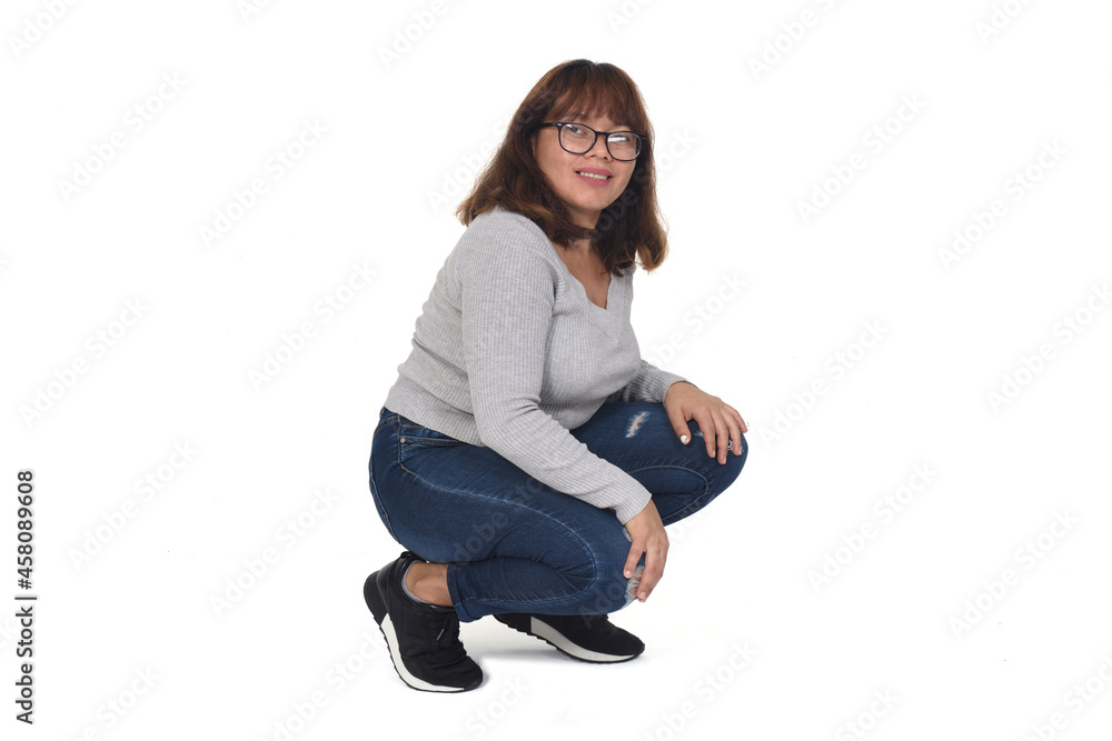 woman squatting and looking at camera on white background woman squatting and looking at camera on white background