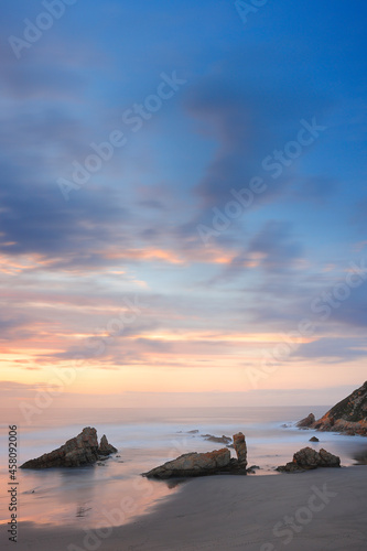 Photography of a long exposure in a sunset in the Playón de Bayas, Asturias, Spain photo