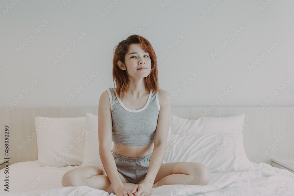 Attractive Asian woman relax after wake up in bedroom. Summer vacation. Attractive Asian woman relax after wake up in bedroom. Summer vacation.