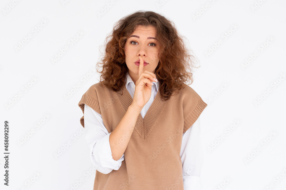 Pretty girl making silence gesture over white background Pretty girl making silence gesture over white background