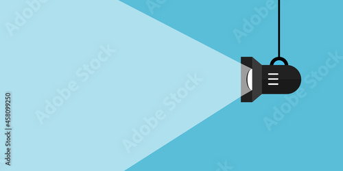 Spotlight shining flat illustration. Movie spotlight on blue background