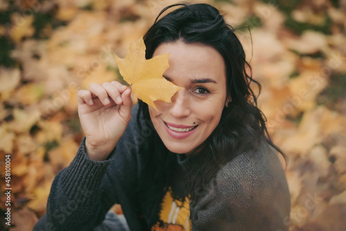 woman with autumn leaves