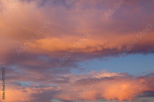 Natural background. Blue sky with pink clouds at sunset. Close-up. © Liudmyla