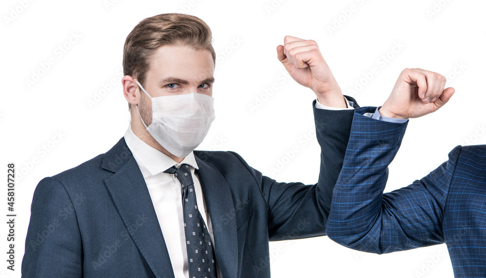 Elbow bumping to fight coronavirus. Lawyer in face mask elbow bump with colleague. Elbow bumping Elbow bumping to fight coronavirus. Lawyer in face mask elbow bump with colleague. Elbow bumping
