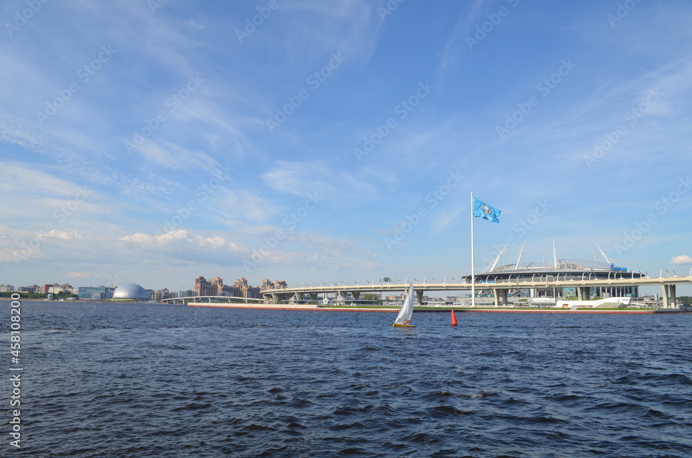 The Gulf of Finland. Sailboat on the sea. Gazprom Arena stadium.