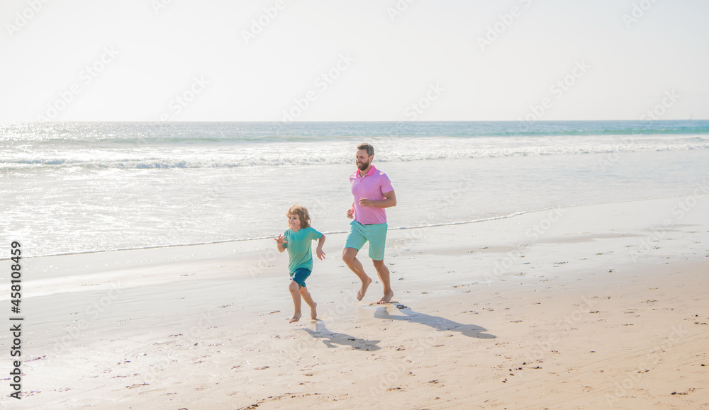 weekend family day. dad and child have fun outdoors. father and son running on sunny summer beach weekend family day. dad and child have fun outdoors. father and son running on sunny summer beach