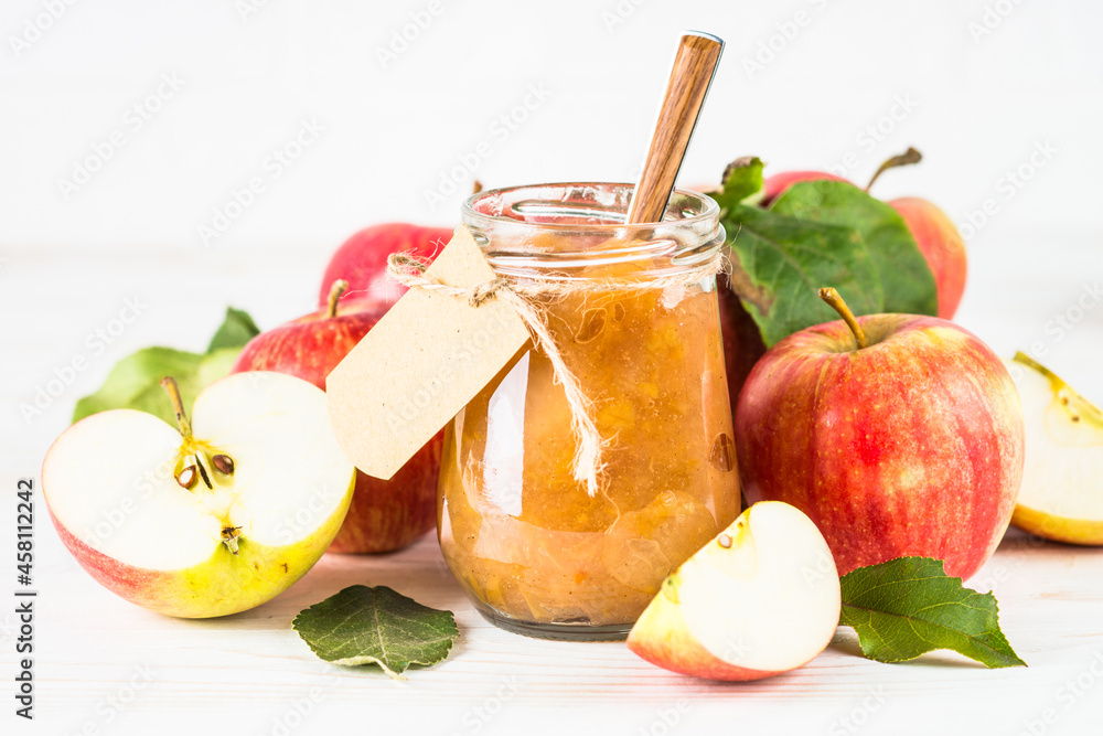Fototapeta premium Apple jam with fresh apples on white background. Healthy sweets, homemade.