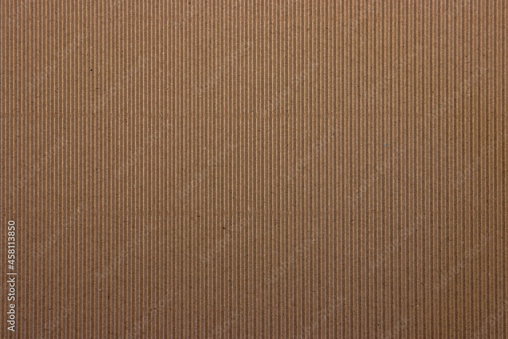 Paper corrugated cardboard textured background, kraft card board striped texture Paper corrugated cardboard textured background, kraft card board striped texture
