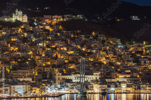 A sailing boat decorates Hermoupolis port...