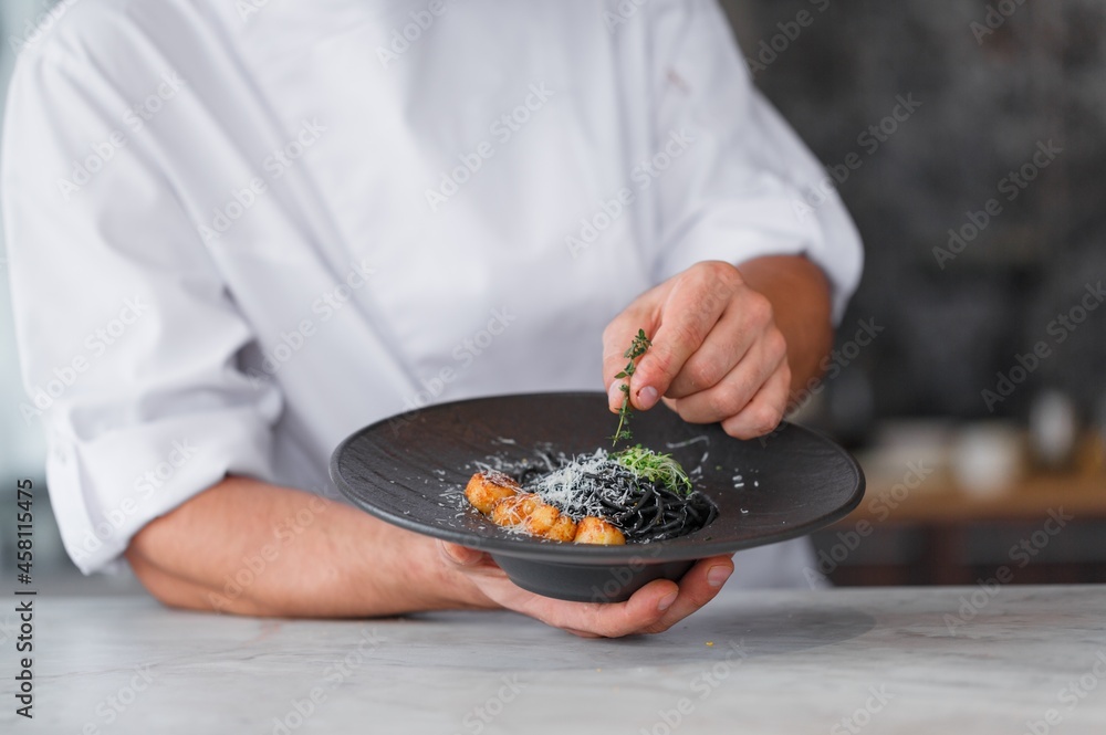 Chef hands cooking Italian pasta and cheese Chef hands cooking Italian pasta and cheese