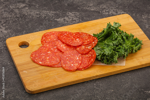 Italian spycy pepperoni sausage slices photo