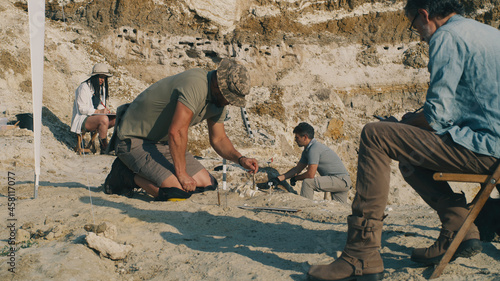 Team of archaeologists excavating fossils