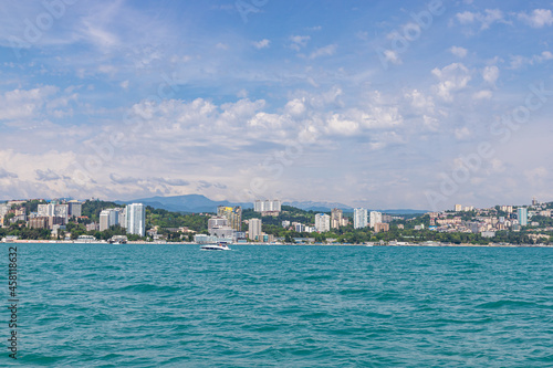 Sochi city coast panorama at summer. View from yacht. Black sea, Russia.