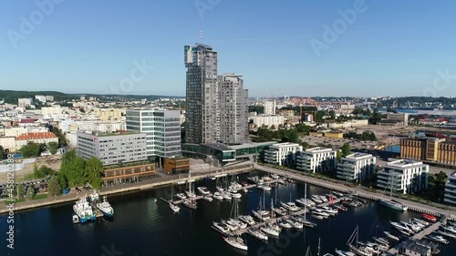 Aerial view of port full of white yachts and sailboats in a modern seaside city, Gdynia. Marina with boats, at summer sunny day. Monaco, France, Croatia, Italy, Fort Lauderdale, Greece.
