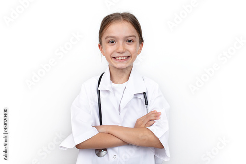 Portrait of a cute little girl dressed as a doctor with a stethoscope.