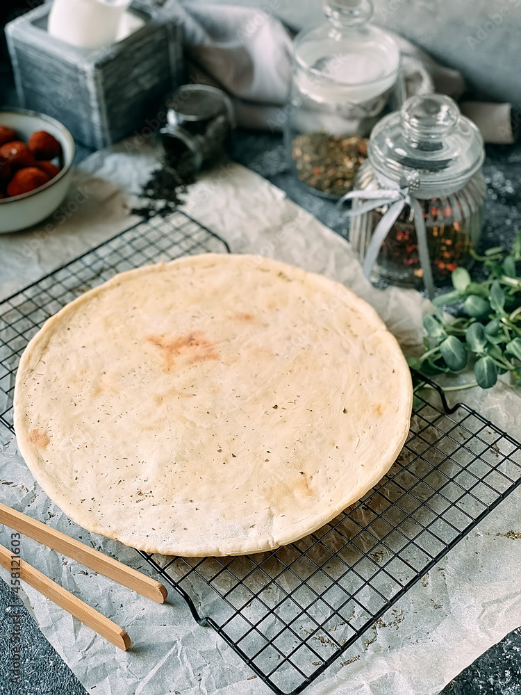 Empty pizza base on wooden board. process of making homemade pizza. Empty pizza base on wooden board. process of making homemade pizza.
