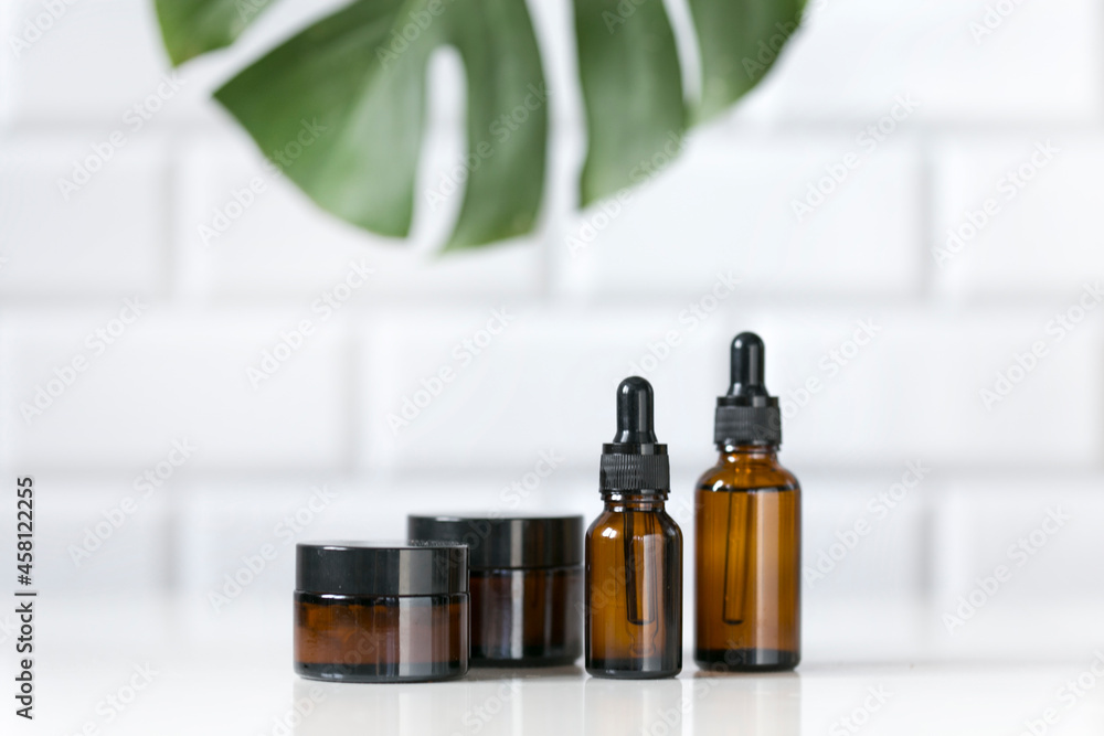 cosmetic containers for skin care on a white table background. Organic spa beauty products cosmetic containers for skin care on a white table background. Organic spa beauty products
