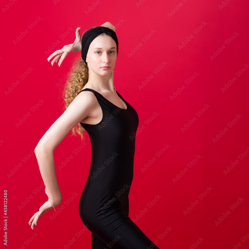 Beautiful slim girl dancer posing in the studio Beautiful slim girl dancer posing in the studio