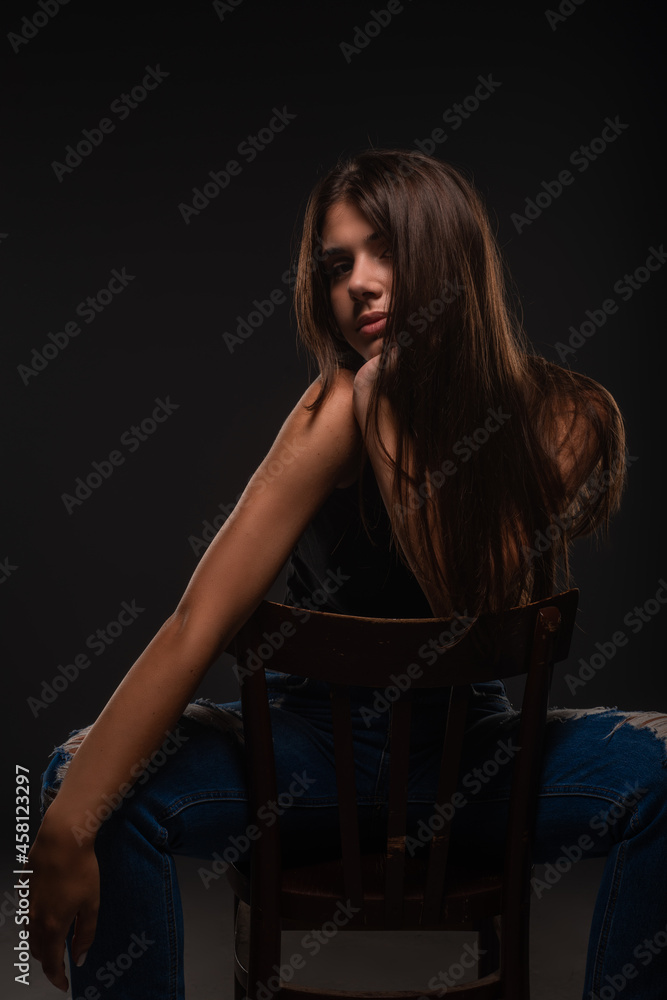 Fototapeta premium Posing while sitting on the small chair